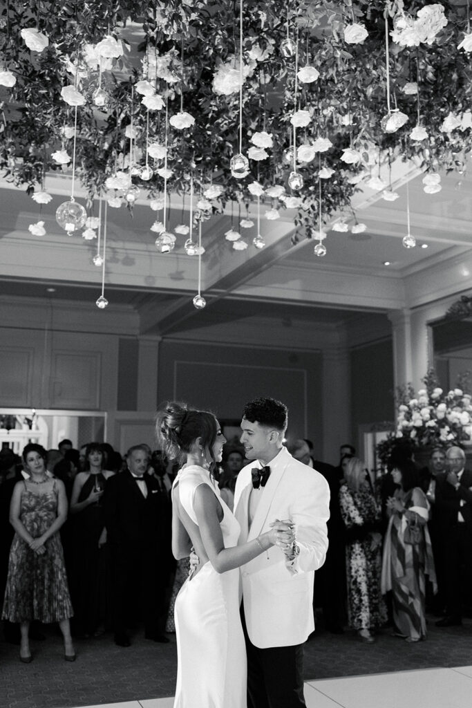 Waverley Country Club wedding couple dancing under floral installation
