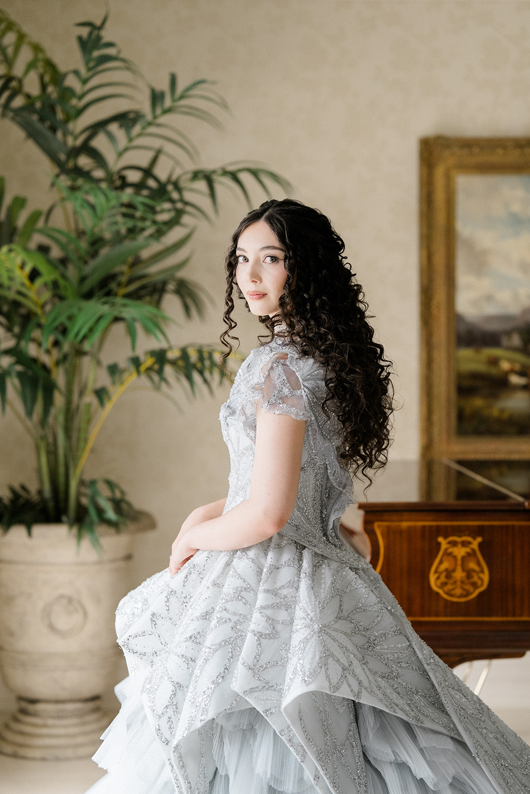 Bride in Jimmy Choo wedding gown, looking at camera